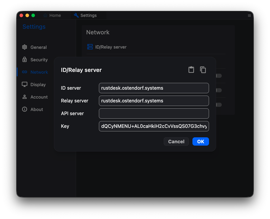 The ID/Relay server dialog with the fields ID server, Relay server, API server and Key, and a paste icon in its top-right corner.